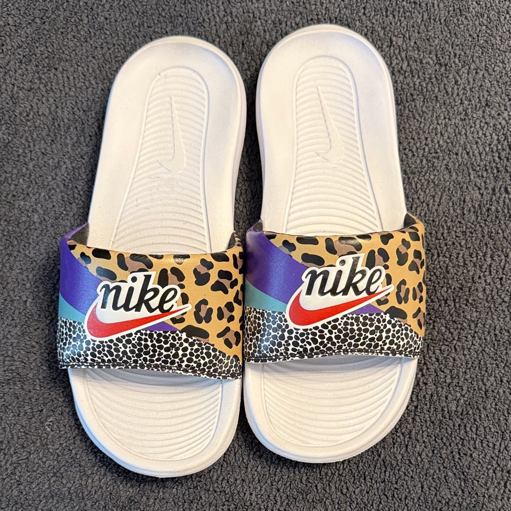 Nike Black and Gold Slides